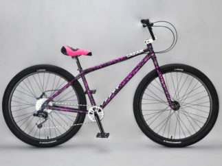 Bomma 27.5 Inch Purple Splatter Mafia wheelie bike at Dewitt Bikeworks
